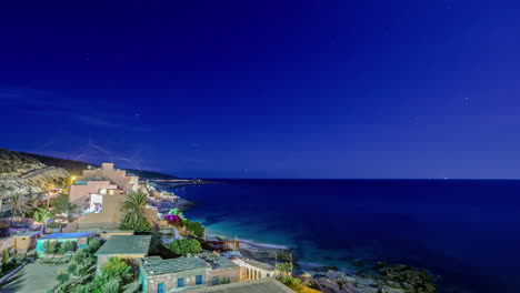 Vista-Panorámica-De-Lapso-De-Tiempo-De-La-Costa-De-Agadir-En-El-Cielo-Azul-Crepuscular-De-La-Noche