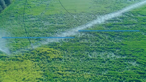 3D render of center-pivot irrigation arm spraying water across green crop rows in daylight