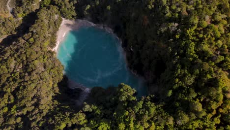 Spectacular-aerial-view-of-Inferno-Crater-Lake,-turquoise-hot-spring-in-Waimangu-Volcanic-Valley,-New-Zealand