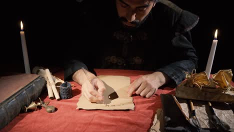 medieval man writing letters. historical video.