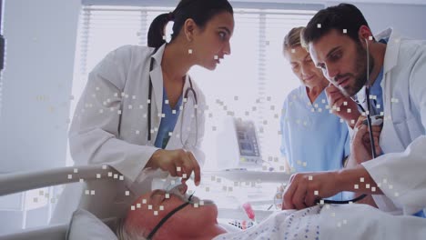 Animation-of-graphs-over-diverse-male-and-female-doctors-examining-senior-patient
