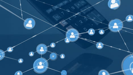 animation of network of people icons over calculator falling on desk