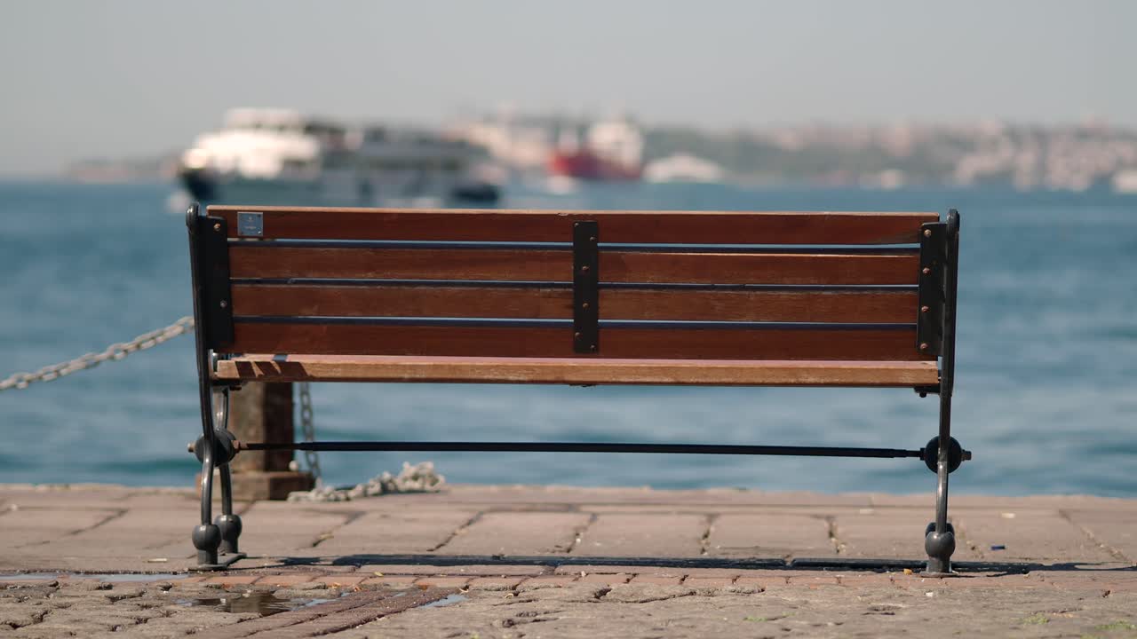 Empty Wooden Bench by the Water