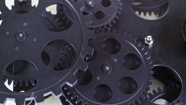 Close Up Shot Of Black Gear Cogs Rotating