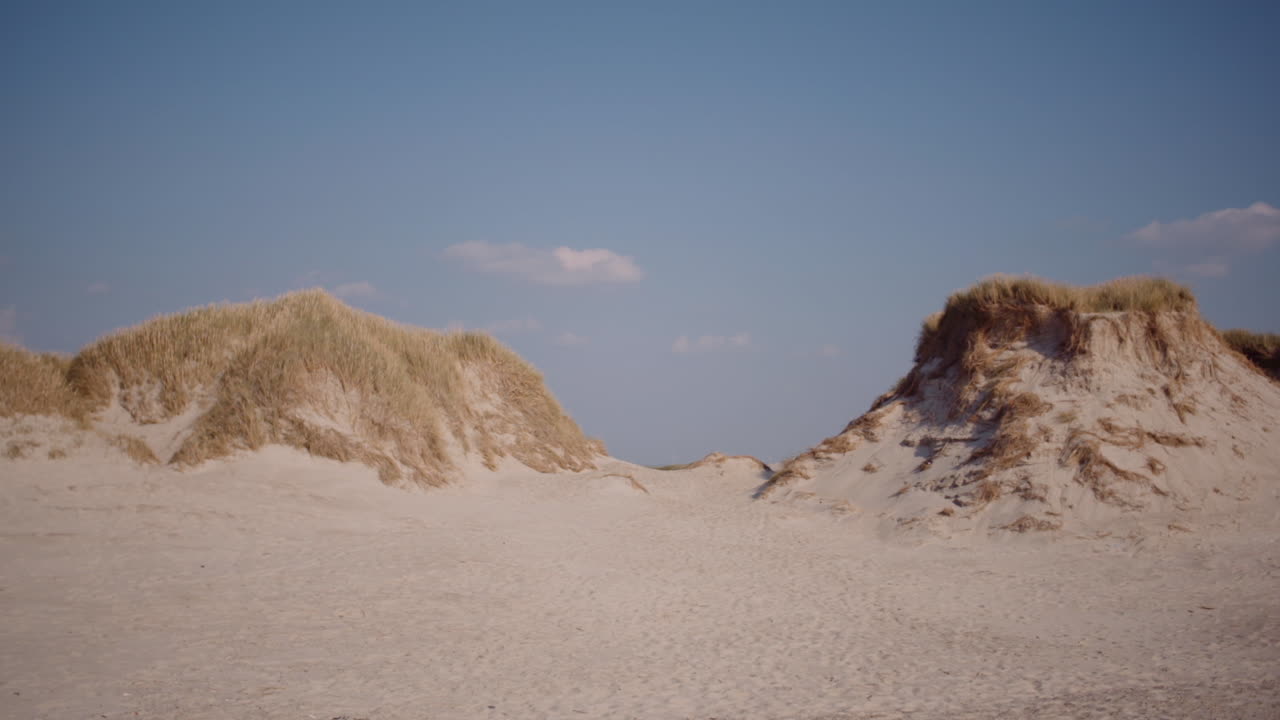 Sand Dunes with Blue Sky Background