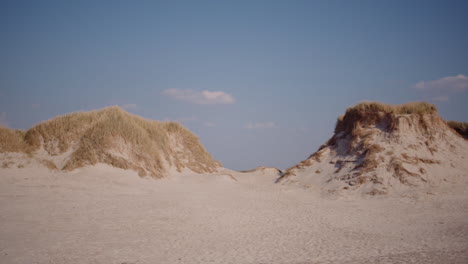 sand dunes with blue sky background