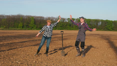 farmers celebrating in a field