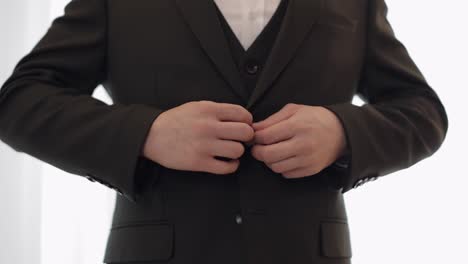 groom getting ready in a suit