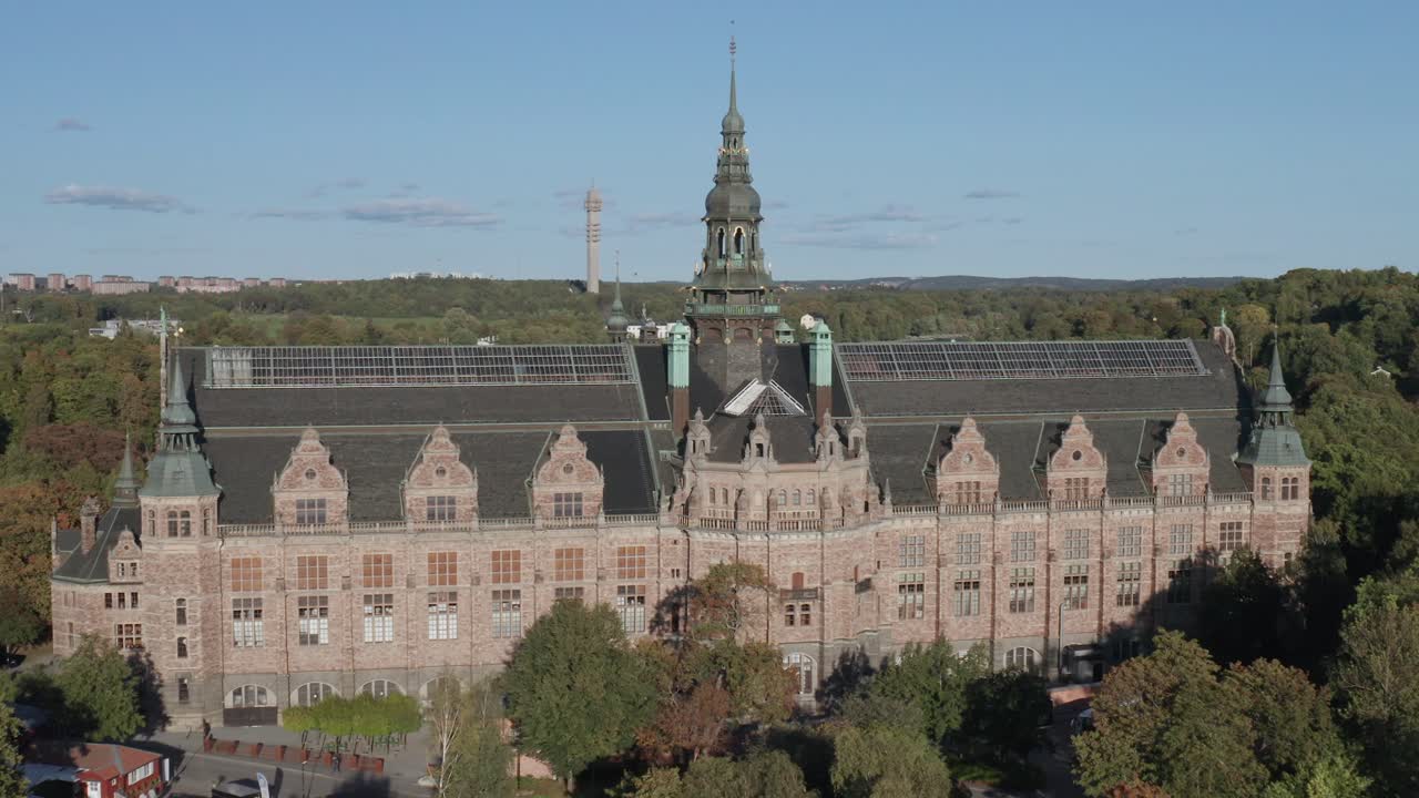 Aerial view of Nordiska Museet with on sunny evening with forest and Kakn&auml;stornet in background on Djurg&aring;rden in Stockholm, Sweden