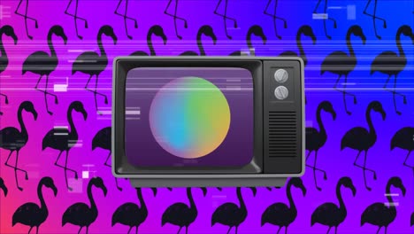 Old-TV-switch-on-with-a-ball-on-screen-against-pink-flamingos-in-background