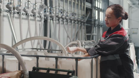 woman touching polypropylene at factory