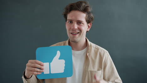man holding a thumbs up sign