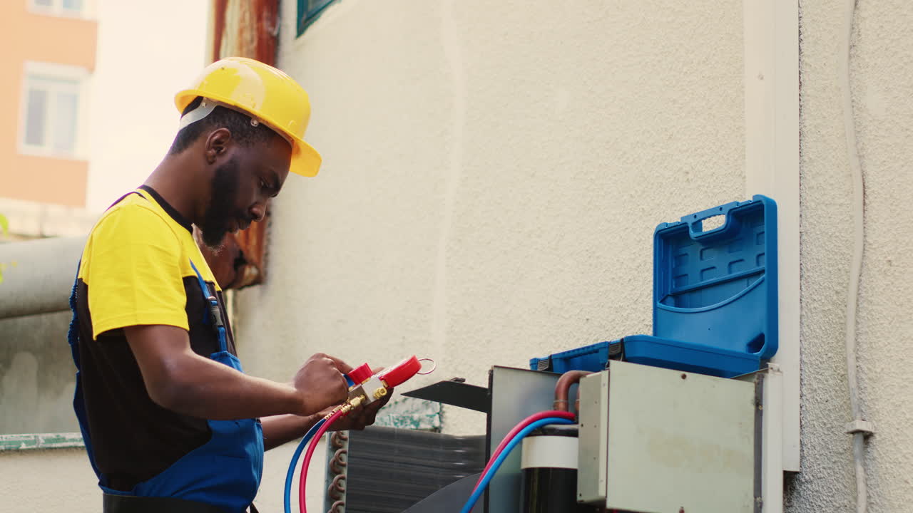 Technician looking at freon levels