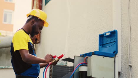 technician looking at freon levels