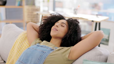 Woman,-breathe-and-hands-behind-head-on-sofa