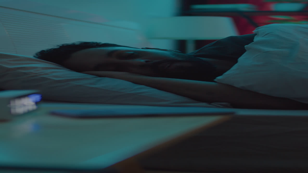 Man Using Phone in Bed before Sleeping at Night