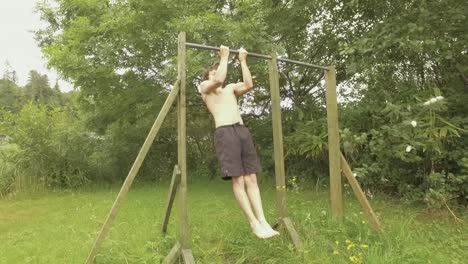 close-grip chin-ups young athletic man working out on home gym