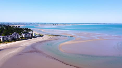 Aerial-Fly-by-over-Meandering-Rivers-formed-by-the-Low-Tide-in-Dublin,-Ireland