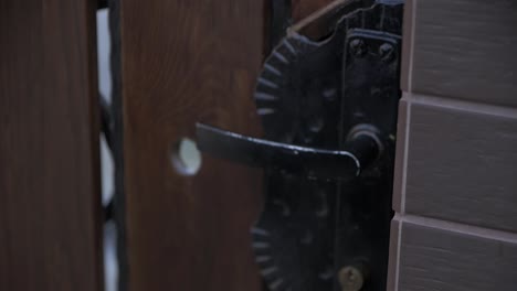 man opening garden door outside