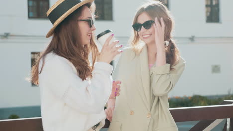 two friends enjoying coffee outdoors