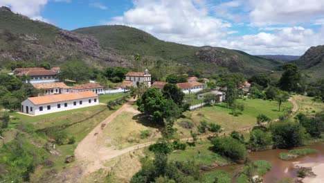 Row-of-old-buildings-beside-the-river-in-the-barren-hills