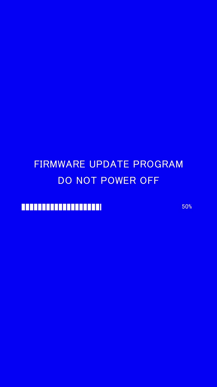 Vertical video of loading progress bar with on-screen text firmware update program do not power off on blue background
