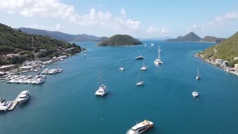 drone-flight-pointing-out-from-the-West-End-Ferry-service-and-Soper's-Hole-marina-toward-the-U