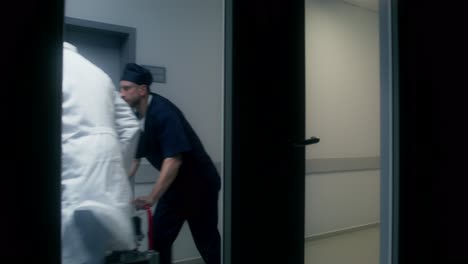 hospital corridor with medical staff and patient