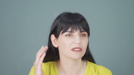 a woman with a hearing problem.