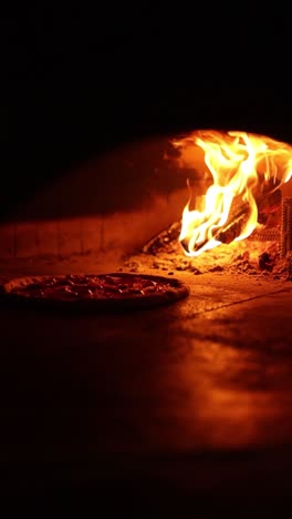 pizza baking in a wood-fired oven