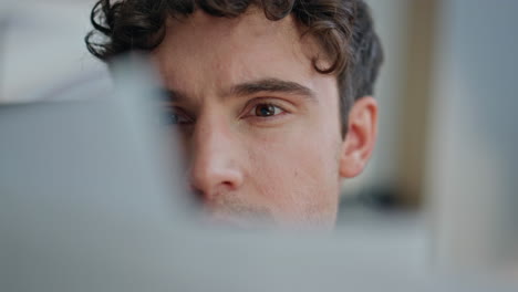 manager face study report in light office closeup. man reading company papers