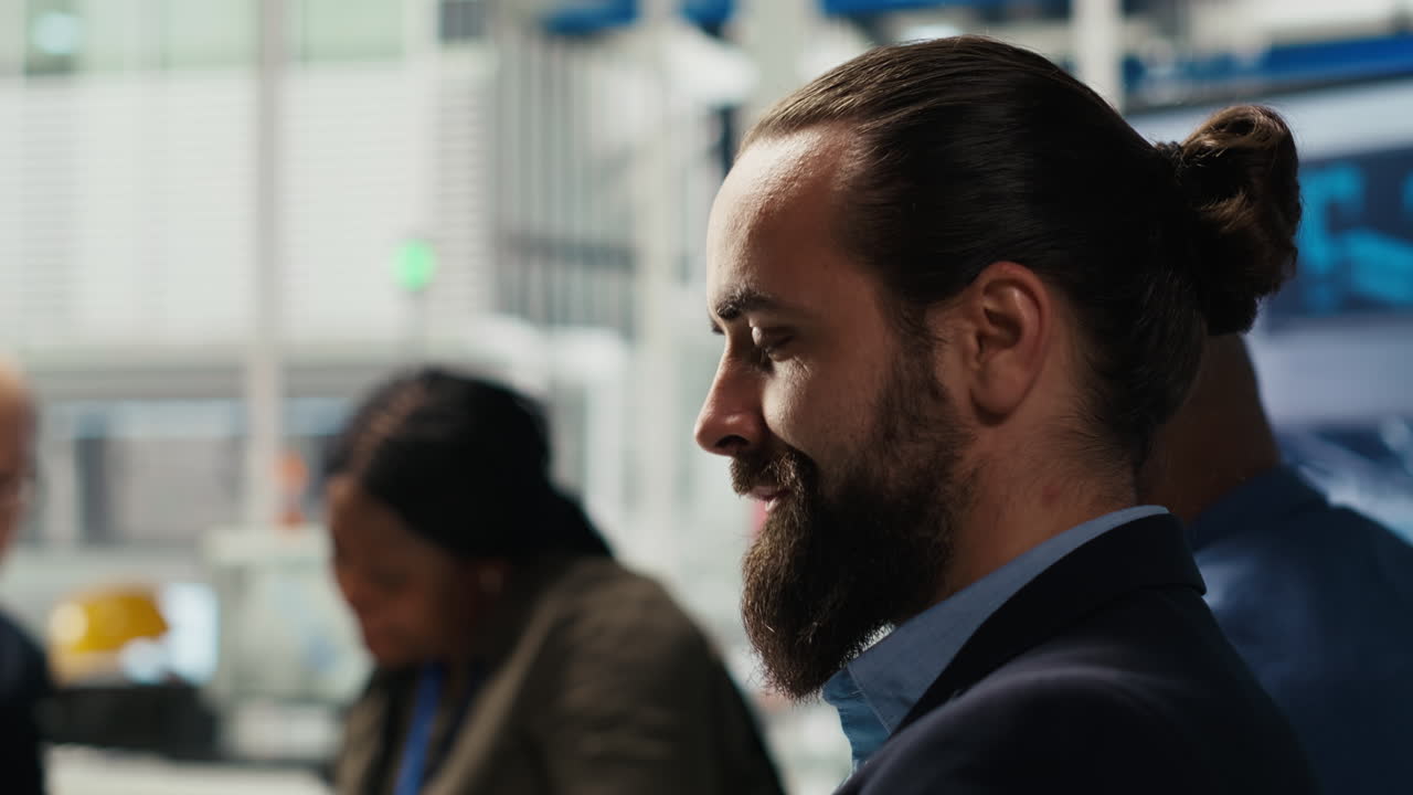 Factory Engineering Team Using Laptop To Increase Energy Output