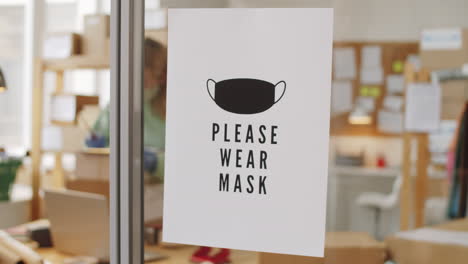 please wear mask sign in a workplace