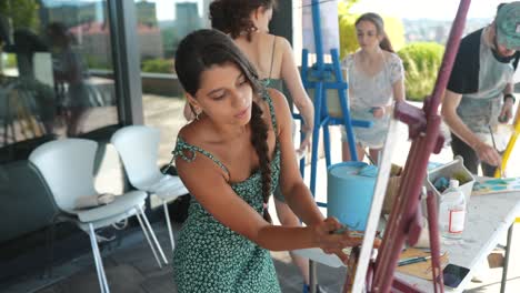 young woman painting outdoors