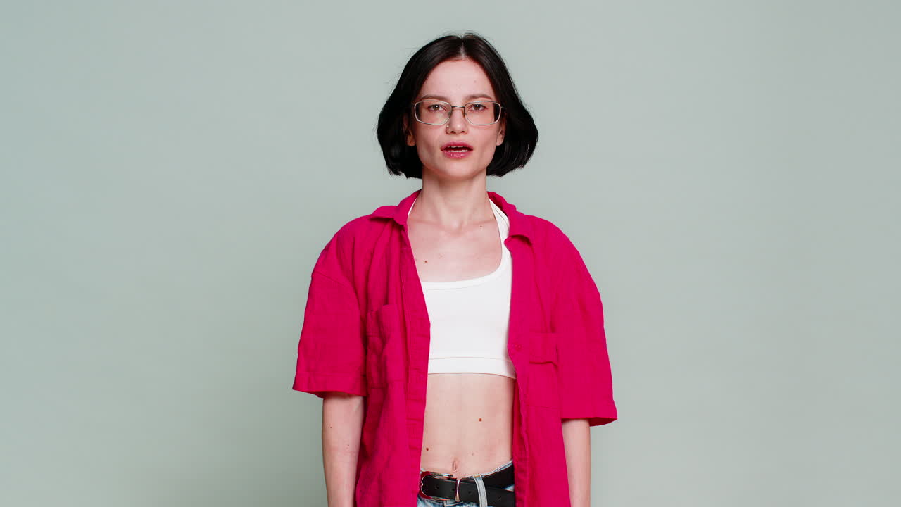 Young woman screaming desperately spreading arms aggressively emotional breakdown anger frustration