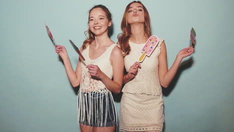 two girls holding ice cream props