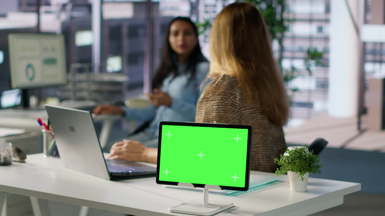 Tablet with green screen in a modern office