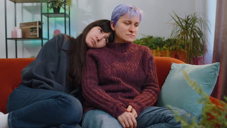 sad lesbian women family couple suffers from unfair situation at home, bankruptcy debt, loan problem