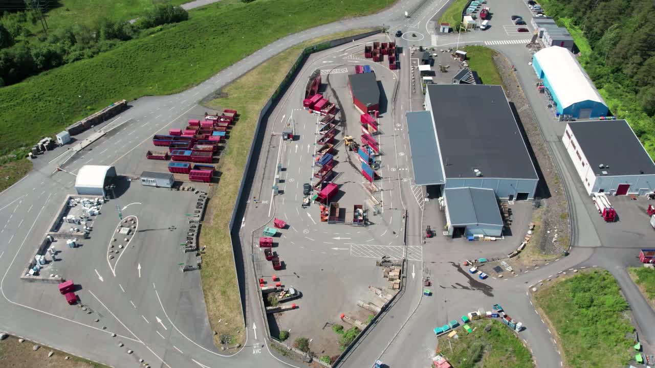 Recycling center or waste center next to the road. Molndal, Sweden, Aerial view