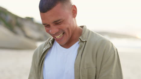 happy man typing, phone and smile on beach