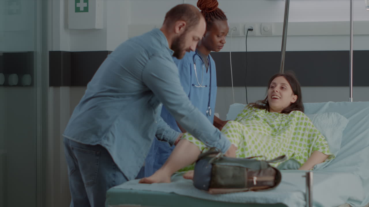 African american nurse supporting pregnant adult