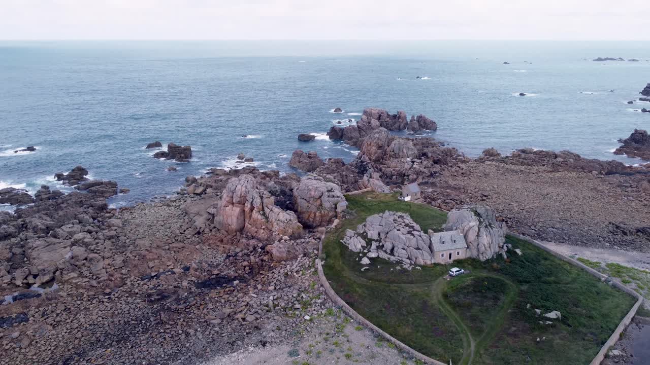 Forward Drone Shot over Brittany's Shore and cute House Stuck in the Rocks, Low Tide, France, gouffre de plougrescant