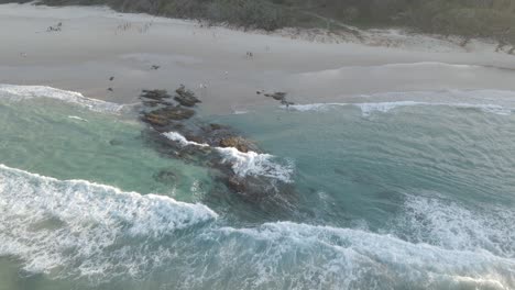 Clear-Blue-Water-With-Waves-Breaking-On-Rocky-Shore-At-The-Deadman's-Beach-In-Point-Lookout