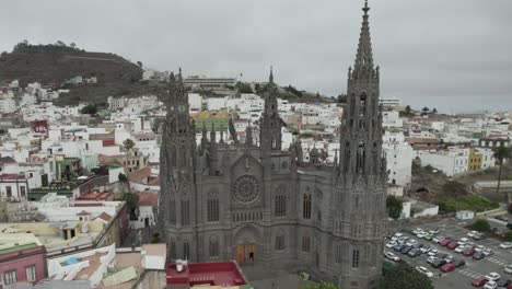 majestic neo ghotic style arucas church against cityscape, canary islands, spain