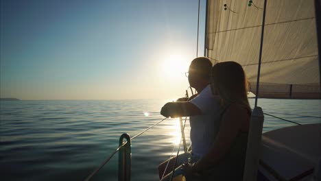 couple sailing at sunset