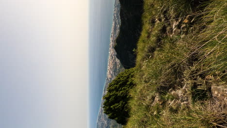 4k vertical shot of a beautiful view of marbella city and blue ocean water from the mountain la concha, marbella, spain