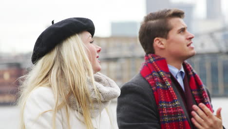 young tourist couple visiting london in winter