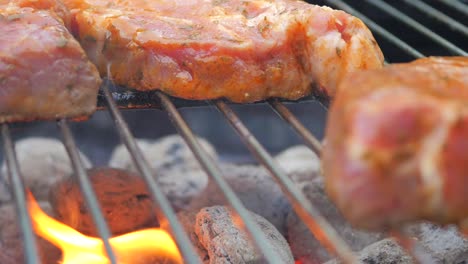 Pork-steaks-being-cooked-by-hot-charcoal