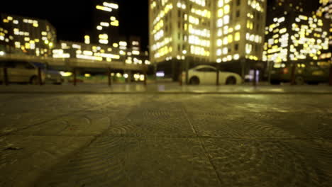 nighttime cityscape with glowing buildings and quiet streets in urban setting