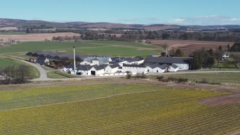 aerial view of fettercairn whisky distillery on a sunny spring day, aberdeenshire, scotland